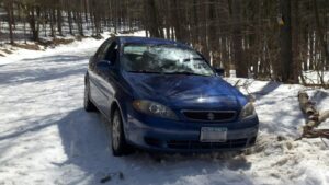 Tim's car stuck on the edge of Van Donsel Rd (photo credit: Timothy Oefelein)