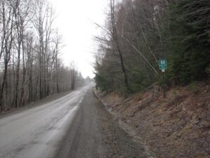 FLT sign at the trailhead on Bleck Rd looking north, trail heading east