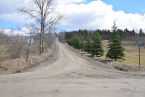 Looking east up Spencer Hill Rd at the intersection of S. Woods Rd - FLT M10