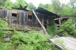 One of the few walls of the old barn still standing
